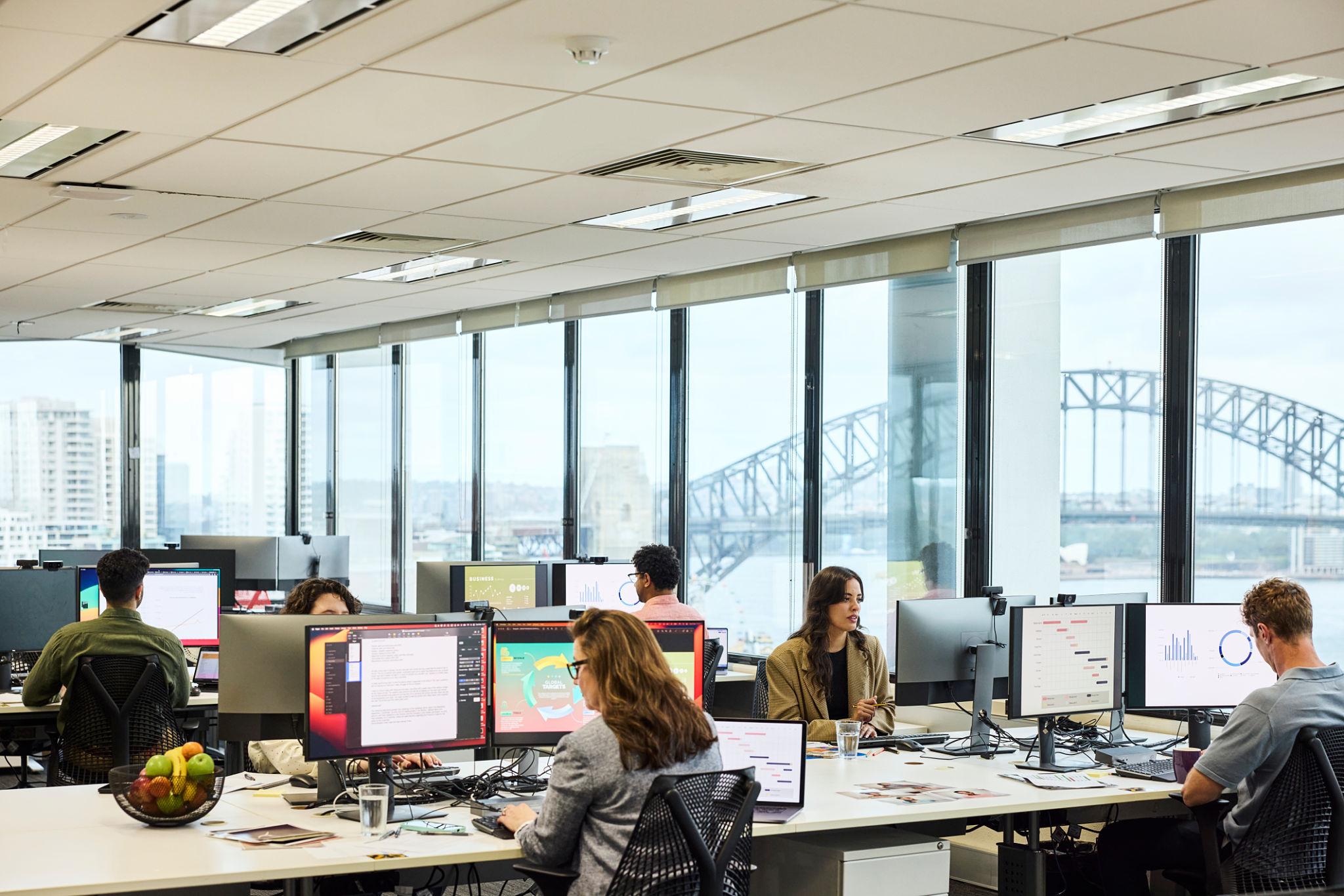 Employees working in a modern office supported by reliable business internet Perth for professional services and connectivity.