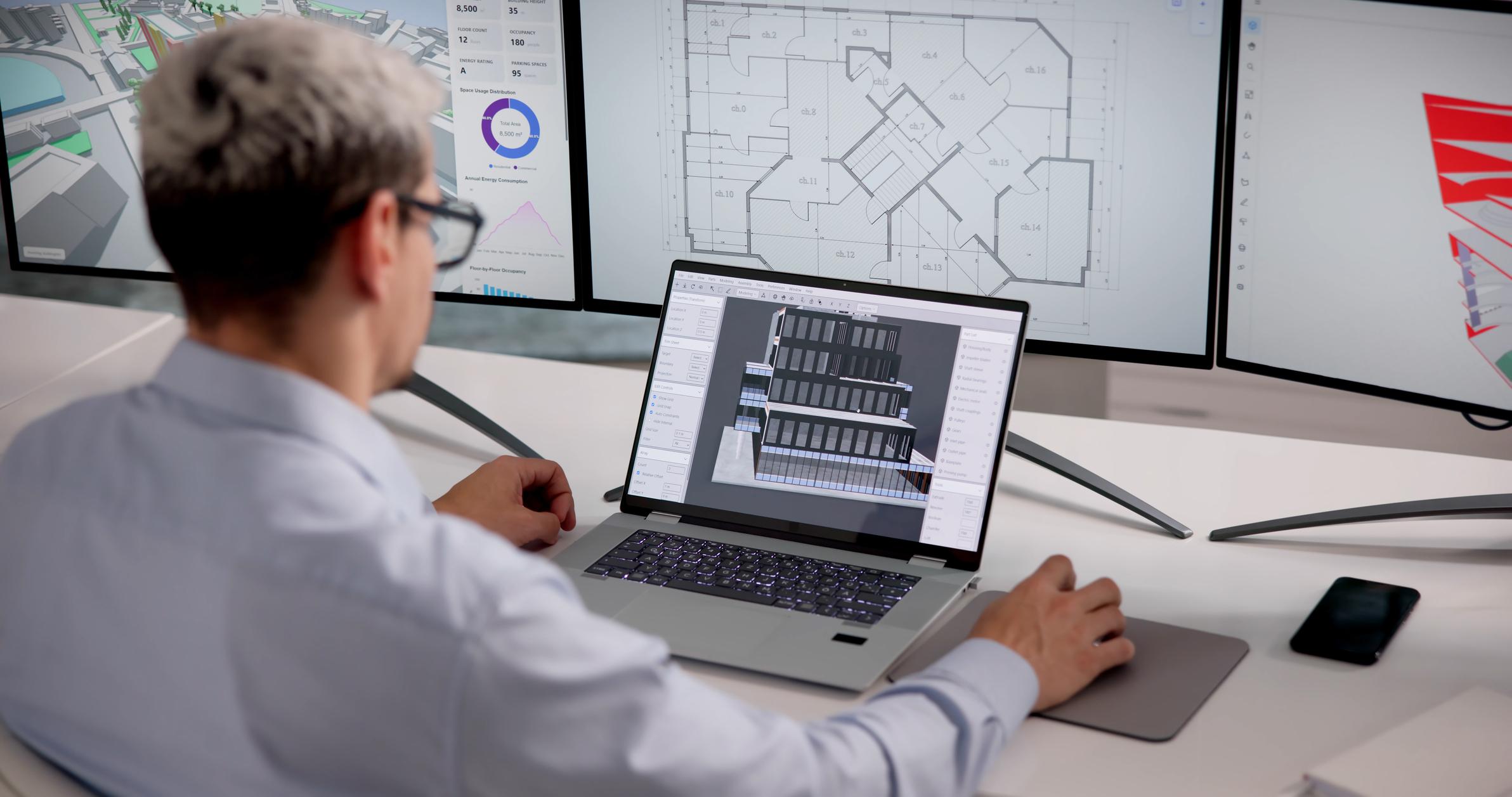 Man working with laptop and three monitors managing Microsoft 365 Backup Australia for secure business data protection.