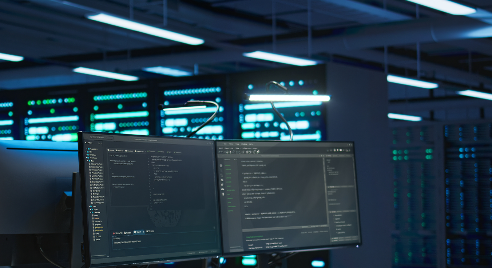 Two computer monitors displaying live system data inside a modern data centre Perth facility with secure IT infrastructure.