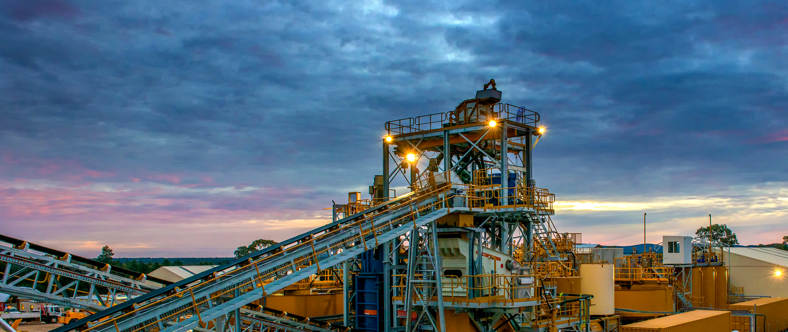 IT support Perth for industrial operations, with a large conveyor belt system positioned in a remote mine site.